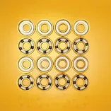 Łożyska hybrydowe 5-kulkowe złote Stelior Black Ceramic do rolek (16 szt.)